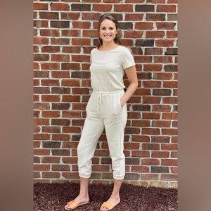 Striped jumpsuit with drawstring waist tie and cropped length